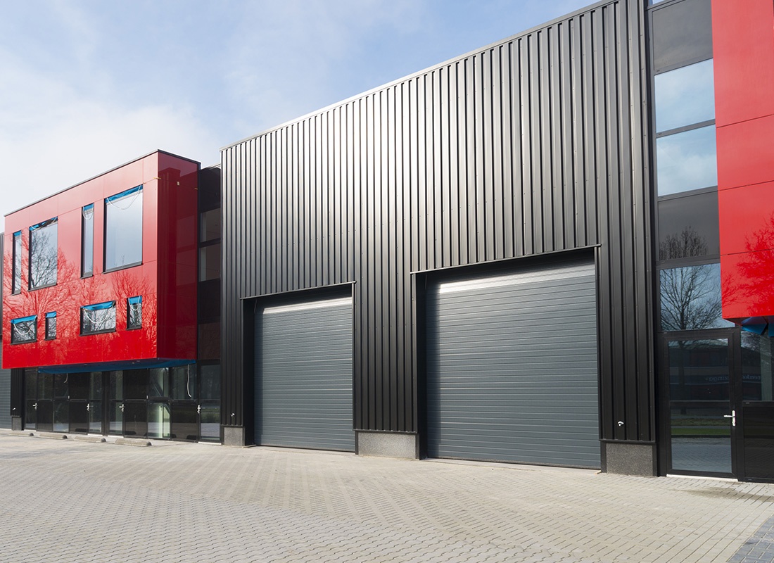 Business Insurance - Modern Business Buildings With Black and Red Exterior on a Sunny Day